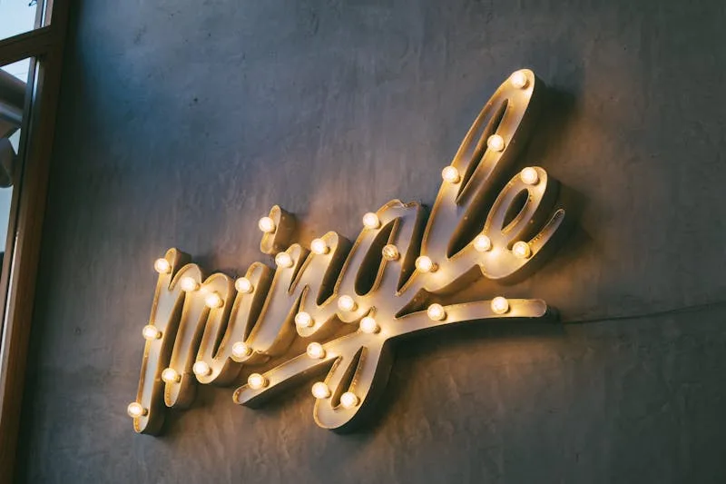 Dimensional illuminated letters mounted on wall — custom lobby sign